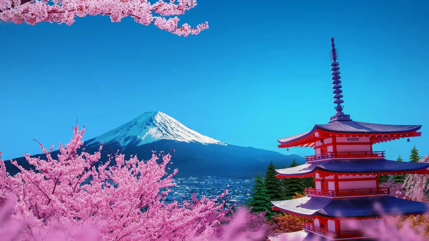 Breathtaking view of Mount Fuji from Lake Kawaguchi with clear blue skies.